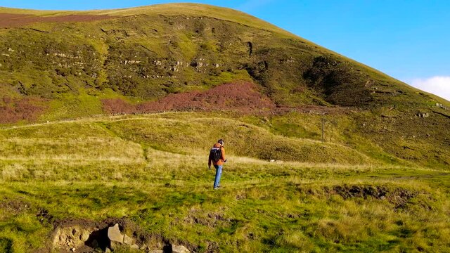A photographer shooting in Peak District, an upland area in England at the southern end of the Pennines, UK