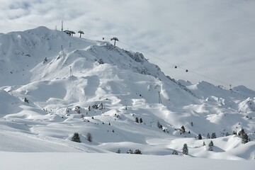 Fototapeta na wymiar View of mountain ski slopes in the French Alps in winter