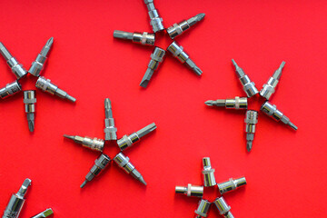 Christmas snowflakes from construction tools on a red background. New year's concept