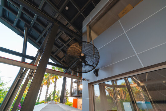 Large fan for cooling and air circulation during hot days, high temperatures and pandemic in public places.