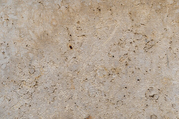 Yellow sandstone facade texture pattern of a stone wall closeup
