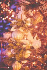 Fototapeta na wymiar Colorful christmas ornaments and decorations hanging from christmas tree