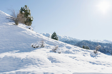 Snow on the Mountain Peaks on a clear Sunny winter day, Chimgan, Uzbekistan