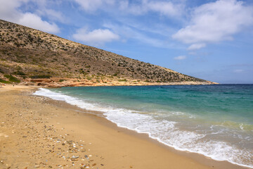 Agia Theodoti beach on Ios Island. A wonderful beach with the golden sand and azure waters. Cyclades, Greece
