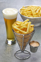 Belgian frites wrapped in paper cone with samourai sauce and beer