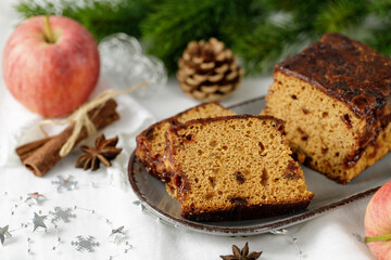 Fototapeta na wymiar Christmas baked homemade sponge cake slices with apples and cinnamon closeup