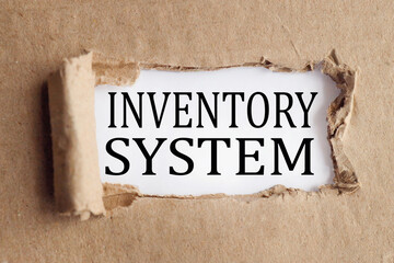 INVENTORY SYSTEM, text on white paper on torn paper background