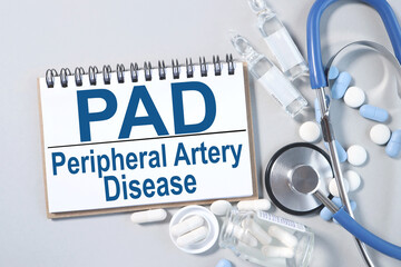 PAD - Peripheral Artery Disease, text on notepad on gray background