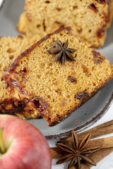 Christmas baked homemade sponge cake slices with apples and cinnamon closeup
