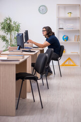 Young male student in tele-education concept