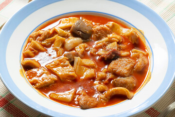 beef tripe stew with  red paprika named callos in spain , typical food