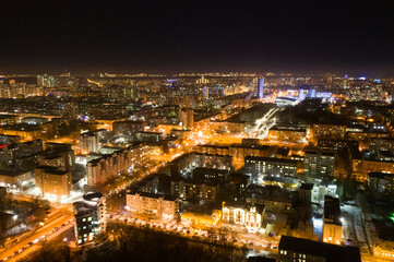 Fototapeta na wymiar Top view of the night modern city. Bright lights of the night streets. Ekaterinburg. Russia