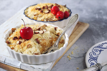 Apple crumble with almonds, two portions, red paradise apples dressing