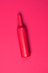 red bottle on .fuchsia background