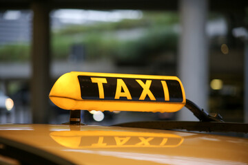 Taxi sign on cab, close-up view