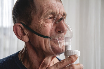 elderly senior with an oxygen mask in quarantine at home