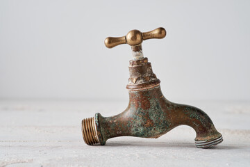 Old dirty brass faucet