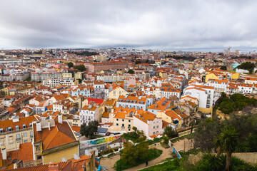 Fototapeta na wymiar view over the capital of Portugal Lisbon Lisboa colorful buildings with orange roofs 