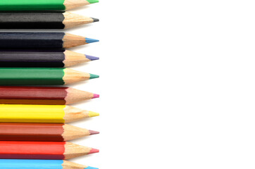 A set of colored pencils on white background