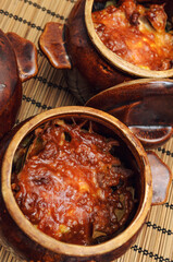 Homemade dishes cooked in the oven, in clay pots