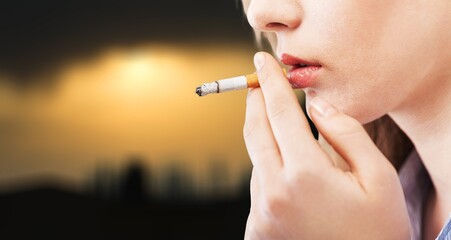 Portrait of the young elegant girl smoking a cigarette
