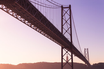 Ponte 25 de Abril Lisboa Lisbon Portugal bridge and Sanctuary of Christ the King, Santuário de Cristo Rei morning sunrise 