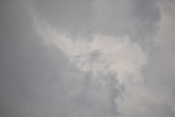 Blue sky with puffy white clouds.