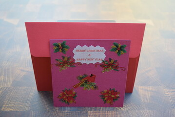 Handmade holiday card with envelope made with card stock. 