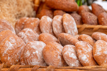Rustic freshly baked bread ciabatta at a food fair (Selective focus)