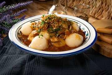 Dumplings with turkey and chorizo sauce.