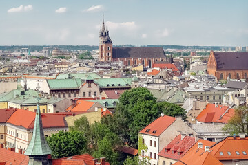 Fototapeta na wymiar Church of Our Lady Assumed into Heaven, also known as Saint Mary's Basilica in Krakow with city panorama from Wawel Hill