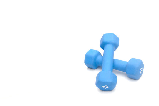 Blue dumbbells on white with copy space