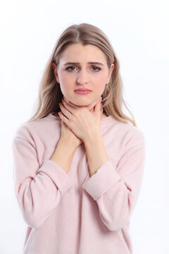 Young woman suffers from sore throat