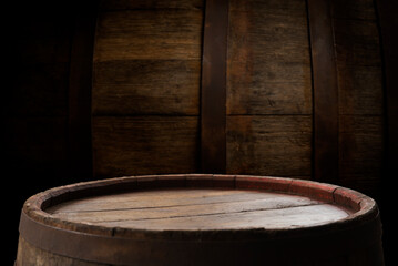 Old wooden barrel on a brown background