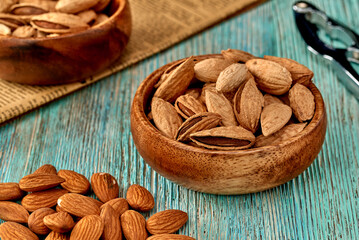Almond kernels lie on a dark background.Selective focus.Salted almonds.