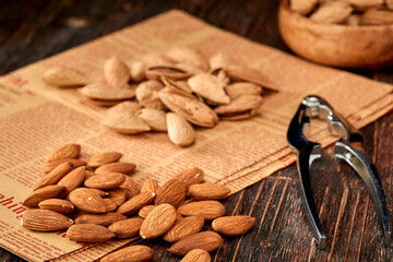 Almond kernels lie on a dark background.Selective focus.Salted almonds.