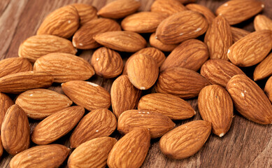 Almond kernels lie on a dark background.Selective focus.Salted almonds.