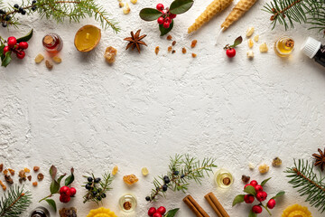 Christmas selection of essential oils with wintergreen, juniper, frankincense, myrrh, spruce,...