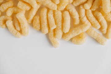 Corn sticks on a white background. Top view. Place for your text