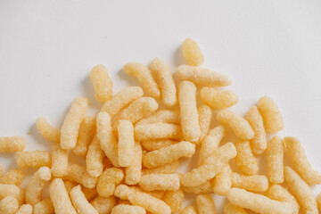Corn sticks scattered on a white background. Top view. Place for your text