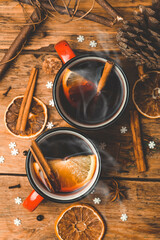 Mulled wine background. A hot winter Christmas drink based on red wine, spices and citrus fruits.