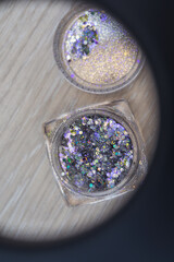 Multicolored sequins in a nail salon for nail design.