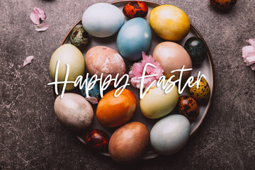 Happy Easter words.. Easter eggs dyed in pastel colors with natural ingredients from red cabbage, onion, spinach, berries, turmeric, coffee. Homemade naturally dyed eggs.