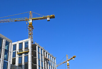 Crane and highrise construction site