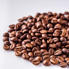 aromatic fresh coffee beans on a white acrylic background