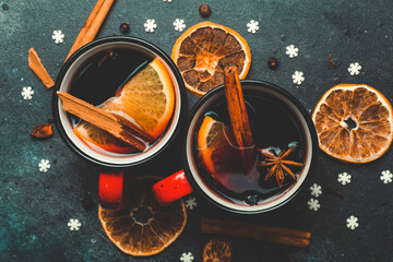 Mulled wine background. A hot winter Christmas drink based on red wine, spices and citrus fruits.