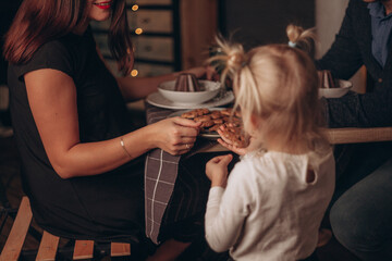 
family eating cookies at the table