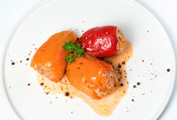 Bell pepper with minced meat on a light background. Culinary background, from the top side.