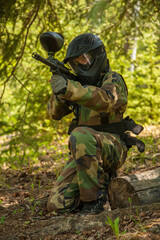 Fototapeta premium boy with paintball gear in forest