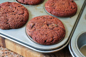 Closeup of a chocolate zucchini muffins in a tray